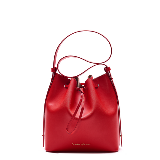 Sandra, crafted by expert artisans at Cristian Marcucci, is the essential, soft, glamorous and timeless bucket bag. It is made of smooth leather and has hand-painted profiles, which adds to its sophistication. The microsuede interior is a luxurious touch . At Mazzi d Fiori